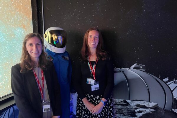 Digital Infrastructure and England's Connected Heartland team members with space suit in the Moon and Mars Room, next to a space suit